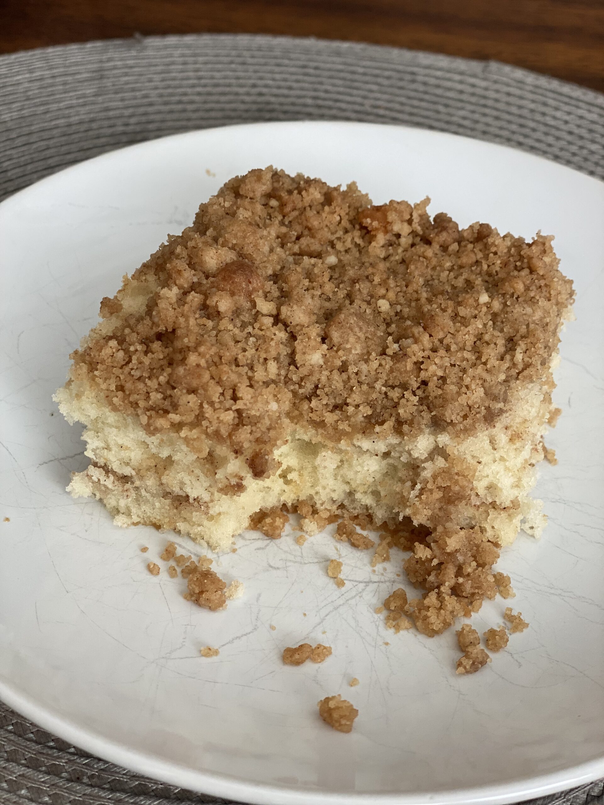Slice of homemade cinnamon coffee cake with a thick streusel topping and cinnamon swirl